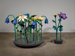 Nathalie Djurberg & Hans Berg, The Clearing (White, Blue, Yellow, and Purple), 2015. Mixed media, revolving plattform, digital video animation (colour, sound), and sound. 144 x 103 x 43 cm and 134 x 190 x 134 cm.
