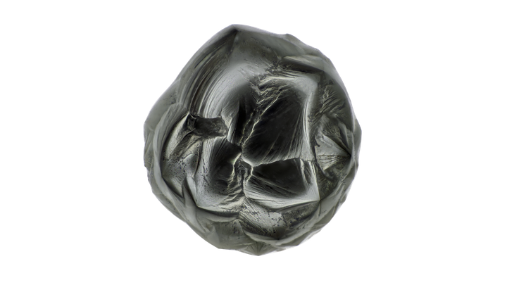 Den største av de fire mikrometeorittene som ble funnet på geologibygningen ved Naturhistorisk museum, er en såkalt kryptokrystallinsk eller finkornet  mikrometeoritt. På grunn av formen kalles denne typen mikrometeoritt for ‘turtleback’ (skilpadderygg).