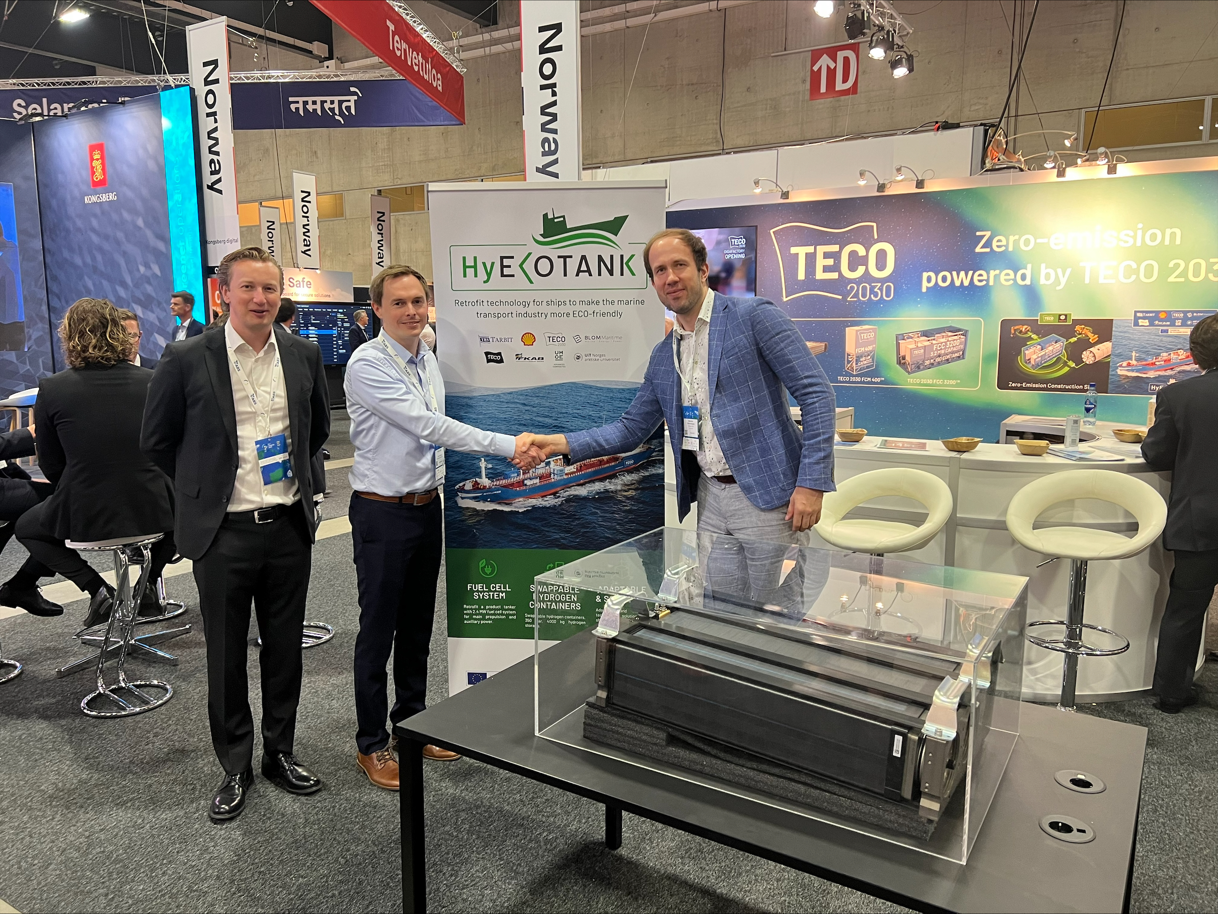 TECO 2030 Booth at Nor-Shipping 2023: TECO 2030 and Skeleton Technologies enter into a strategic partnership to boost renewable hydrogen as a zero-carbon fuel for the maritime sector. From left, TECO 2030 COO Tor-Erik Hoftun and Director of Business Development Fredrik Aarskog, together with Sales Director Kersten Eero from Skeleton Technologies on the right.