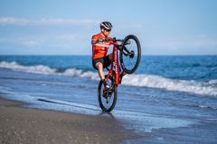 Mathias Flückinger enjoying his great season with a wheelie at the beach in Italy. Foto by Martin Steffen