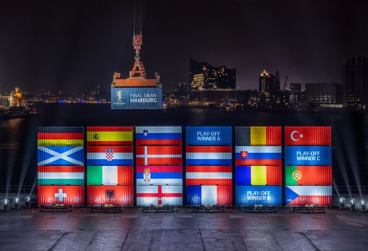 Port workers in Hamburg stack containers with flags of the EURO 2024 teams in accordance with the Final Draw. Photo: Hamburg Marketing GmbH