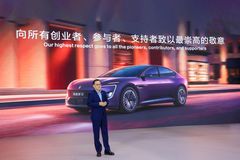 Zhu Huarong, Chairman of China Changan Automobile Group, speaks at the roll-off ceremony, honoring the pioneers, contributors, and supporters of the company.