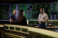 employees in a control room