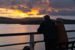 A couple enjoys the sunset on board Havila Pollux.