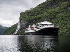 Havila Castor in the Geirangerfjord. 2nd of June 2022, Havila Castor was the first cruise ship to sail into the world heritage fjord, the Geirangerfjord, on battery, emission-free.