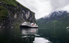 Havila Castor in the Geirangerfjord. 2nd of June 2022, Havila Castor was the first cruise ship to sail into the world heritage fjord, the Geirangerfjord, on battery, emission-free.