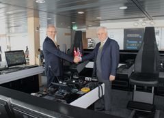 Arne Johan Dale, CFO of Havila Kystruten and Mr. Nurettin Paksu, Chairman of the Board of Tersan Shipyard shake hands after delivery of Havila Castor.