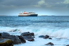 Havila Capella seen from land at the west coast of Norway at the maiden voyage