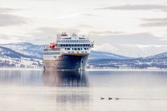 Havila Capella sailing through a winter landscape.