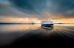 Havila Capella sailing in the midnight sun