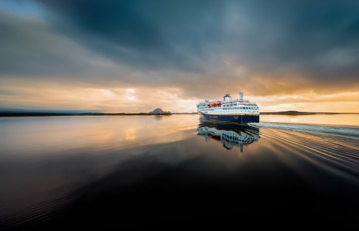 Havila Capella sailing in the midnight sun