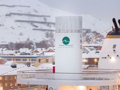 Havila Polaris docked at Polarbase outside Hammerfest, bunkering liquified biogas.
