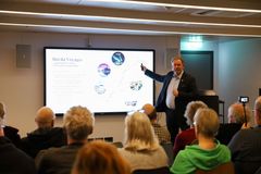 Bent Martini, CEO of Havila Voayges, holds a presentation for guests on board Havila Polaris.