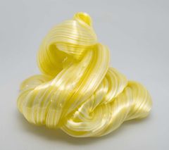 A yellow mass with white stripes made of glass.