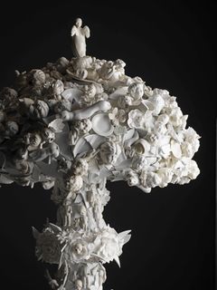Tiny pieces of porcelain are pieced together in a mushroom like installastion.