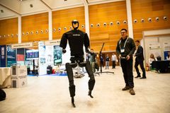 A walking black robot being demonstrated at the European Robotics Forum 2024.
