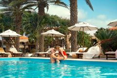 Couple kissing by pool in Cabo Verde