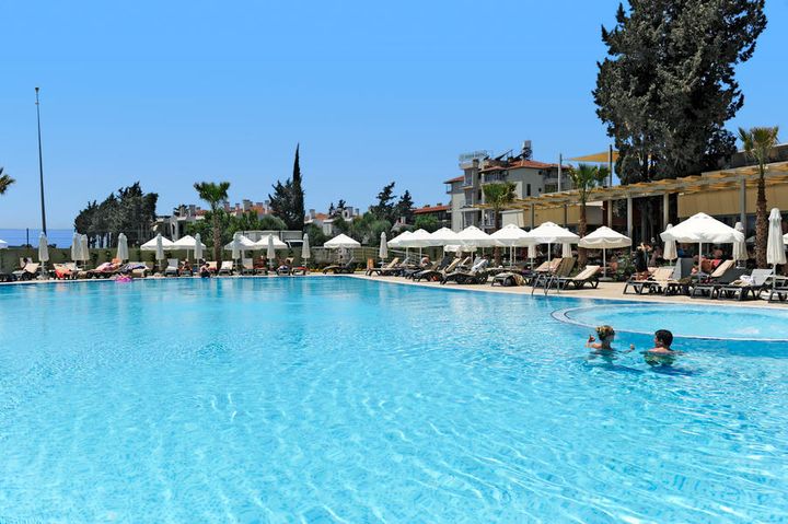 A pool in a hotel in Side Turkey with to adults swimming