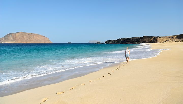la-graciosa-beach-woman-walking-on-beach