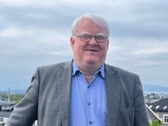 Nærbilde av Terje Andre Olsen som smiler